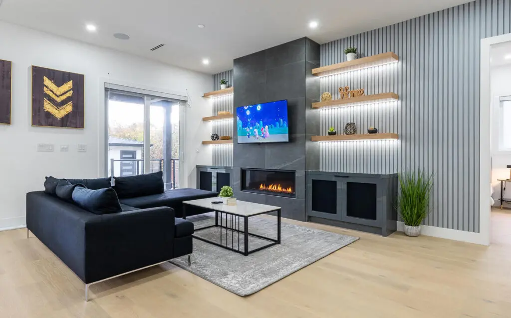 Unwind in this elegantly designed living room, where modern luxury meets comfort. Featuring a sleek fireplace, curated decor, and a state-of-the-art smart TV, it’s the perfect space to relax and recharge in style.