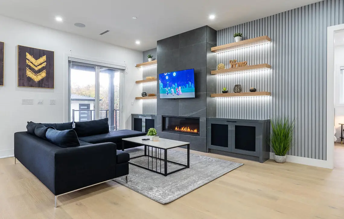 Unwind in this elegantly designed living room, where modern luxury meets comfort. Featuring a sleek fireplace, curated decor, and a state-of-the-art smart TV, it’s the perfect space to relax and recharge in style.