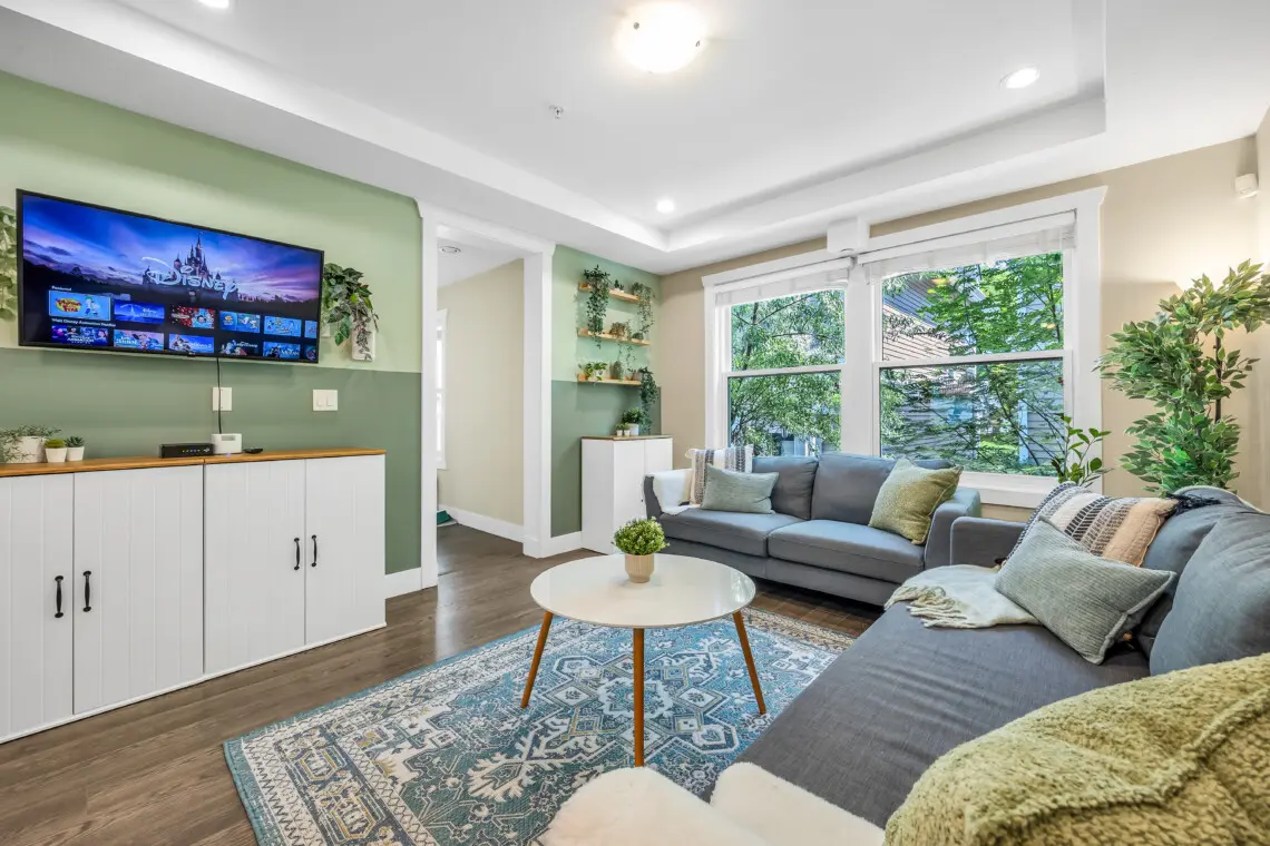 Cozy living area with ample seating and a Smart TV—perfect for enjoying your favorite shows with loved ones.