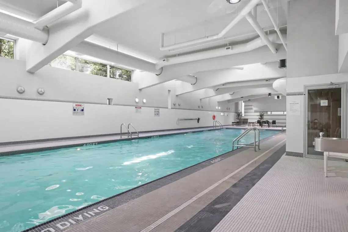 A bright indoor pool offers a peaceful space to swim or unwind year-round, with high ceilings and natural light creating an airy, relaxed atmosphere. A welcome amenity for longer stays, perfect for maintaining your routine or enjoying a quiet moment close to home.