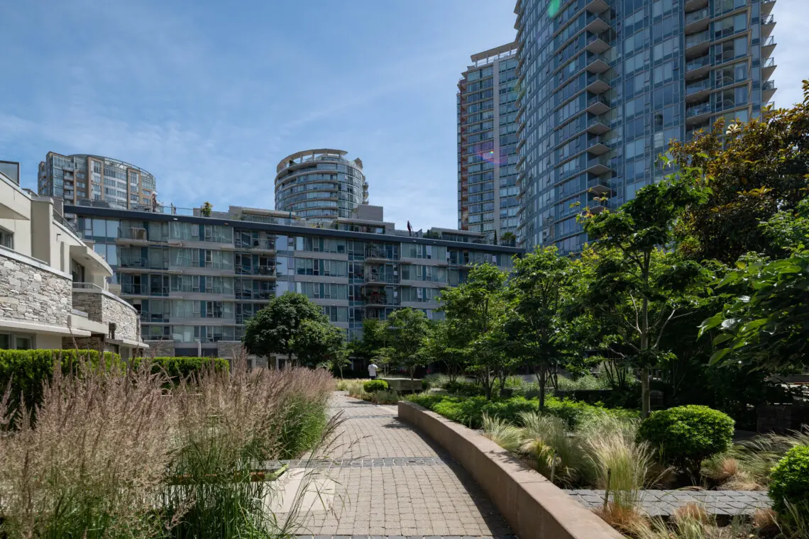 Serene Courtyard — relax and recharge in this lush, landscaped garden oasis, offering a peaceful escape right in the heart of downtown Vancouver.