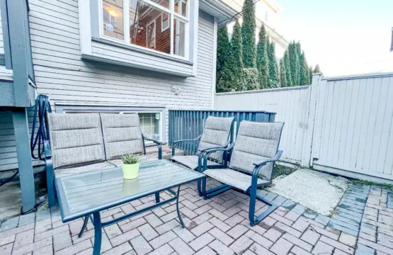 Relax outdoors in the private garden patio, featuring comfortable seating for four — perfect for morning coffee, evening chats, or enjoying fresh Vancouver air.