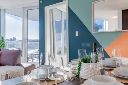 Enjoy a meal with a view — this elegant dining space opens seamlessly to the balcony and living area, creating the perfect setting for memorable gatherings and intimate dinners alike.