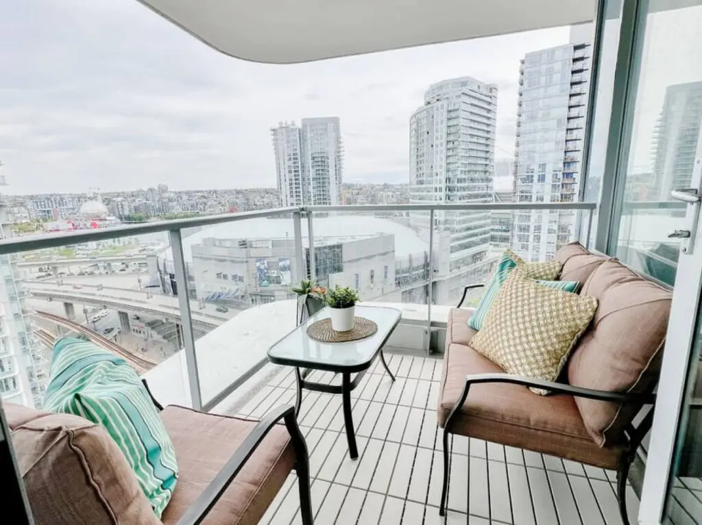 Balcony bliss awaits — relax in your private outdoor retreat overlooking the vibrant Downtown Vancouver skyline. Perfect for morning coffee or sunset unwinding, this cozy space captures the essence of elevated urban living.