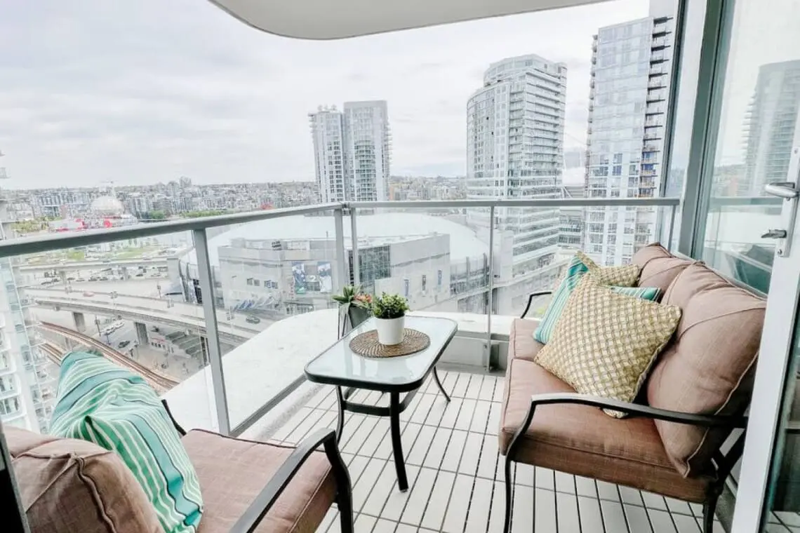 Balcony bliss awaits — relax in your private outdoor retreat overlooking the vibrant Downtown Vancouver skyline. Perfect for morning coffee or sunset unwinding, this cozy space captures the essence of elevated urban living.