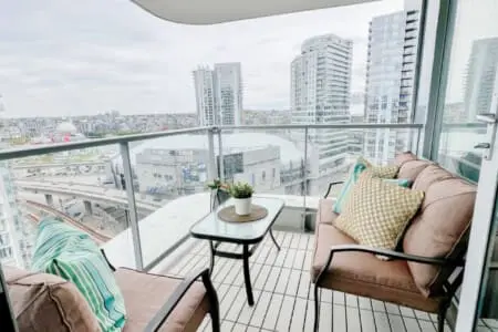 Balcony bliss awaits — relax in your private outdoor retreat overlooking the vibrant Downtown Vancouver skyline. Perfect for morning coffee or sunset unwinding, this cozy space captures the essence of elevated urban living.