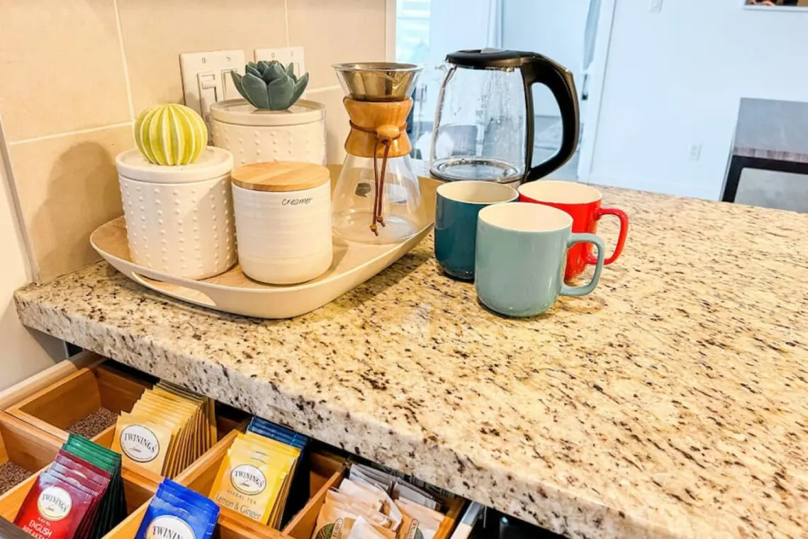 Guests can begin their mornings at the inviting coffee and tea station, thoughtfully stocked with a selection of Twinings teas, fresh brew options, and all the essentials for a cozy start. It’s the perfect touch of comfort to ease into your Vancouver day.