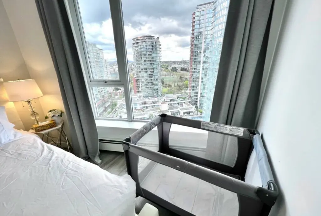 A thoughtful touch for families — a Pack ’n Play with a comfortable folding mattress is ready for your little one’s stay. Set beside stunning city views, this cozy corner ensures even the youngest guests enjoy a peaceful Vancouver escape.