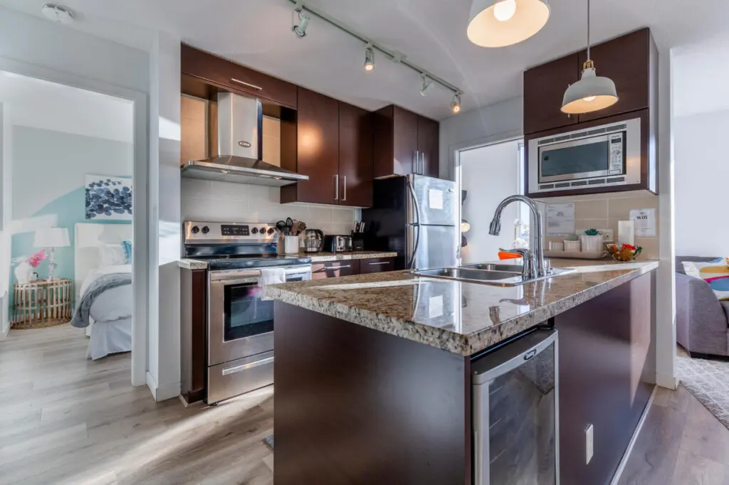 Enjoy stylish simplicity in this modern, fully equipped kitchen — complete with sleek finishes, stainless-steel appliances, and plenty of space to cook and connect. Perfect for preparing home-cooked meals during your Vancouver stay.