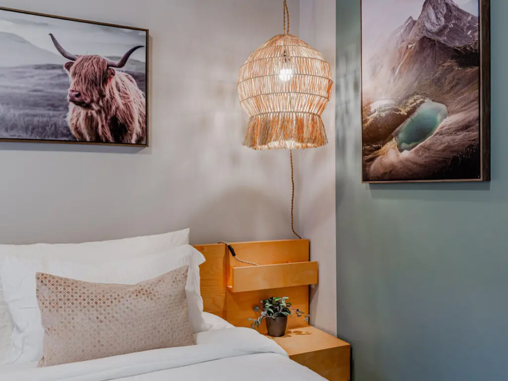 Unwind after a day of exploring in the inviting king bed, surrounded by warm lighting and calming natural accents — the perfect retreat during your Vancouver stay.