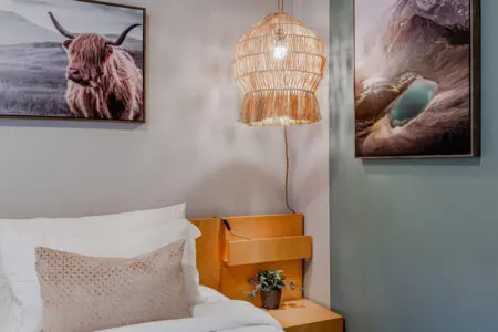 Unwind after a day of exploring in the inviting king bed, surrounded by warm lighting and calming natural accents — the perfect retreat during your Vancouver stay.