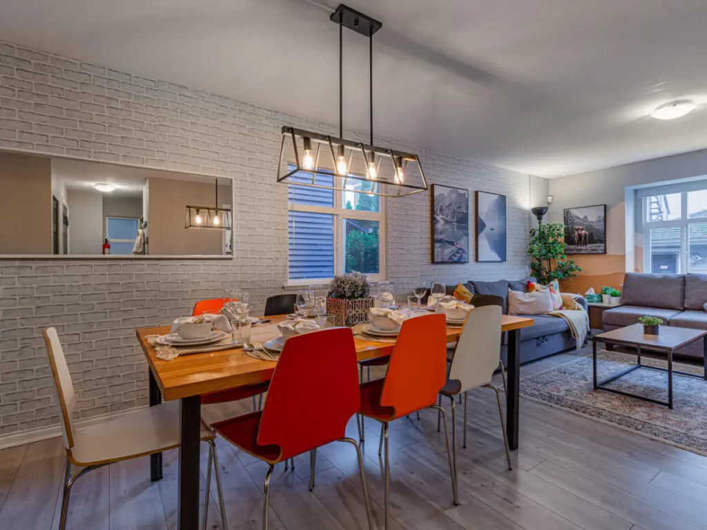 The open-concept layout seamlessly connects the living, dining, and kitchen areas, creating a bright and social atmosphere. Perfect for gatherings, this inviting space blends comfort, style, and functionality for a relaxed stay.