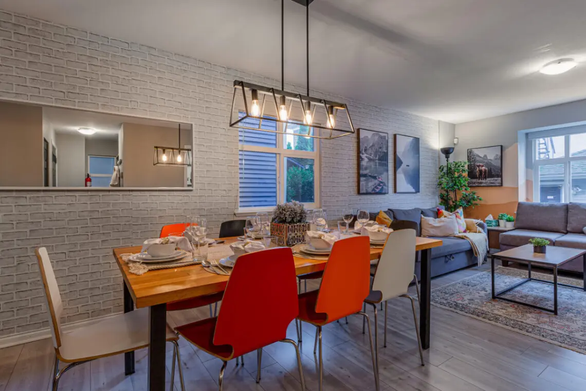 The open-concept layout seamlessly connects the living, dining, and kitchen areas, creating a bright and social atmosphere. Perfect for gatherings, this inviting space blends comfort, style, and functionality for a relaxed stay.