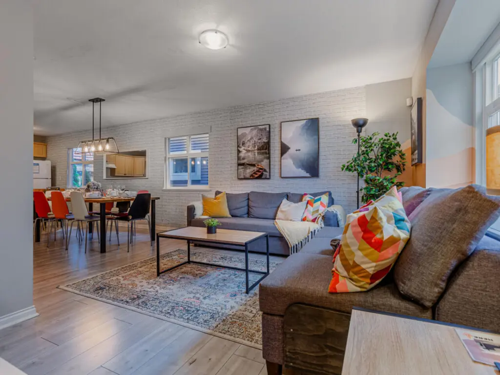 Relax in the open-concept living, dining, and kitchen area — a bright, welcoming space designed for comfort, connection, and easy gatherings with family or friends.