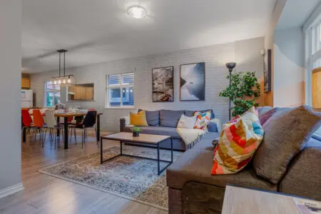 Relax in the open-concept living, dining, and kitchen area — a bright, welcoming space designed for comfort, connection, and easy gatherings with family or friends.