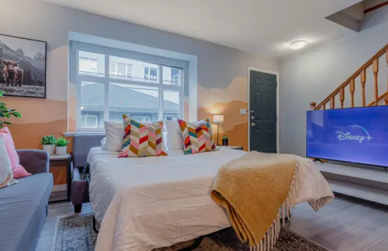 The cozy sofabed easily transforms into a comfortable sleeping space for two, perfect for extra guests or family members. A warm, welcoming setup that adds flexibility and comfort to your Vancouver stay.