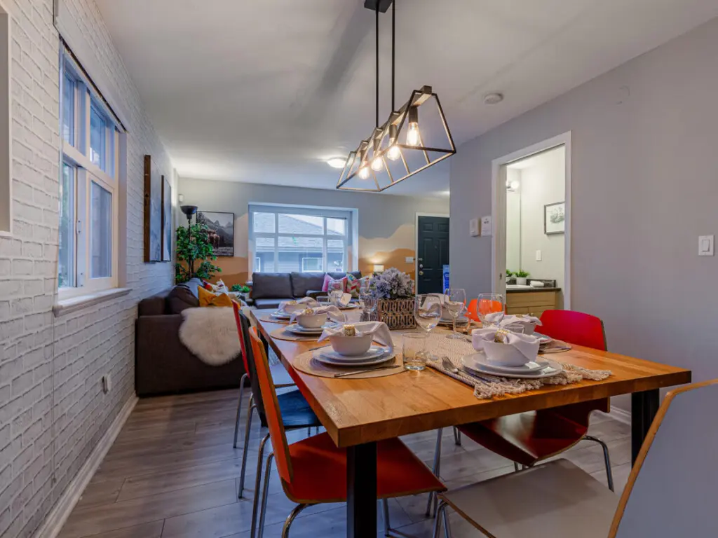 The spacious kitchen island doubles as a convenient breakfast station and extra prep space, making it ideal for both casual dining and cooking together with family or friends.
