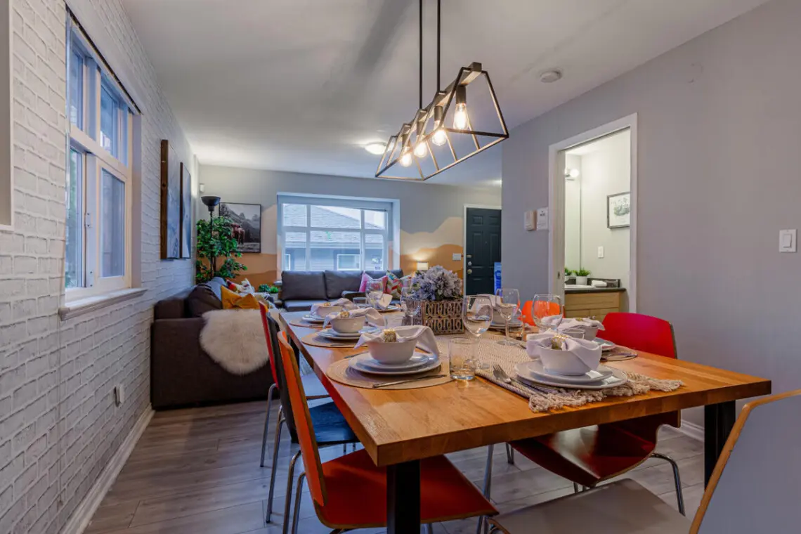 The spacious kitchen island doubles as a convenient breakfast station and extra prep space, making it ideal for both casual dining and cooking together with family or friends.
