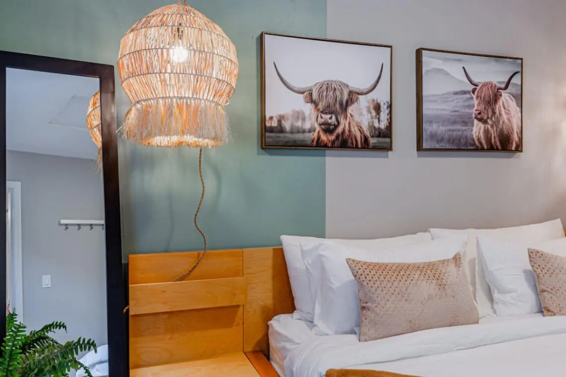 Settle into the cozy king bed after a day of city adventures, surrounded by soft lighting and natural textures that create a peaceful, restful ambiance.