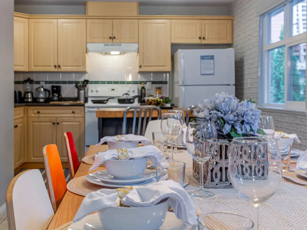 Enjoy effortless cooking and conversation in this open kitchen and dining area, designed for connection and comfort. A warm, social space where shared meals and memorable moments enhance your Vancouver stay.