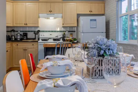 Enjoy effortless cooking and conversation in this open kitchen and dining area, designed for connection and comfort. A warm, social space where shared meals and memorable moments enhance your Vancouver stay.