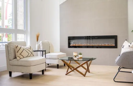 Unwind in the inviting sitting room off the front entryway, featuring a sleek electric fireplace. The perfect space to relax and enjoy quiet moments in your home away from home.
