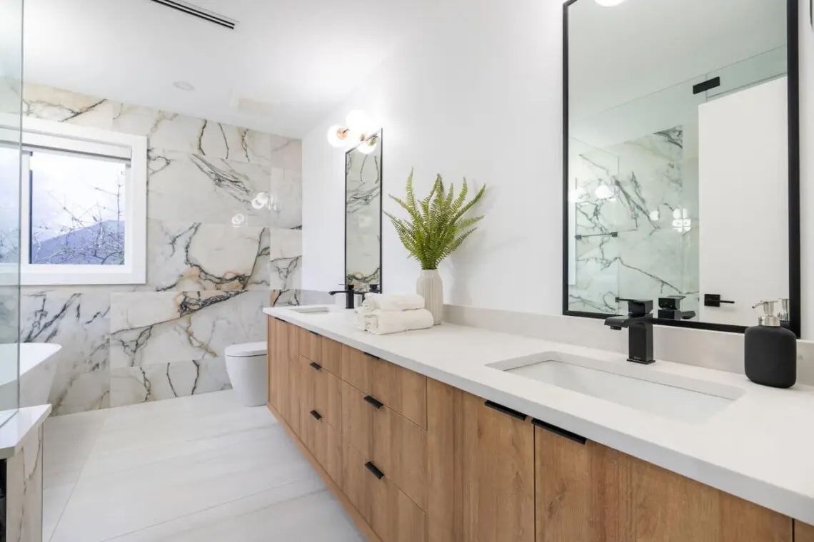 Ensuite Bathroom (Connected to Primary Bedroom 1): Experience tranquility in this spa-inspired ensuite featuring elegant finishes and a serene atmosphere — the perfect private retreat for unwinding in style.