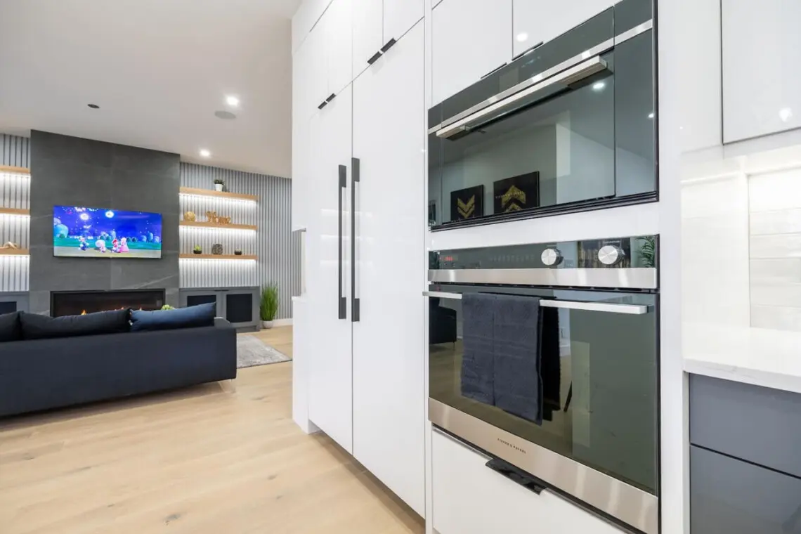 Bring your culinary visions to life with premium stacked wall ovens in a sleek, fully equipped kitchen — perfect for creating unforgettable meals and moments with loved ones.