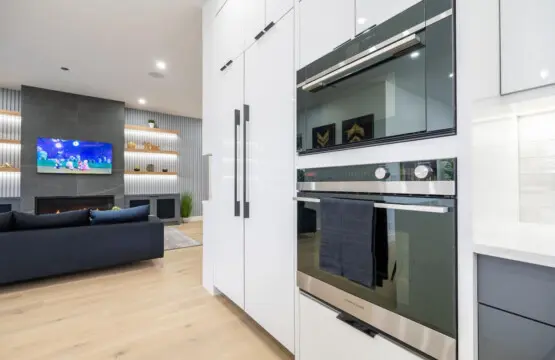 Bring your culinary visions to life with premium stacked wall ovens in a sleek, fully equipped kitchen — perfect for creating unforgettable meals and moments with loved ones.