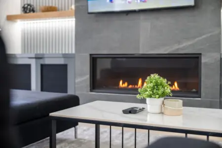 Gather around the modern indoor fireplace and enjoy cozy moments with loved ones. Perfect for unwinding after a day of exploring, this inviting space sets the scene for warmth, laughter, and lasting memories.