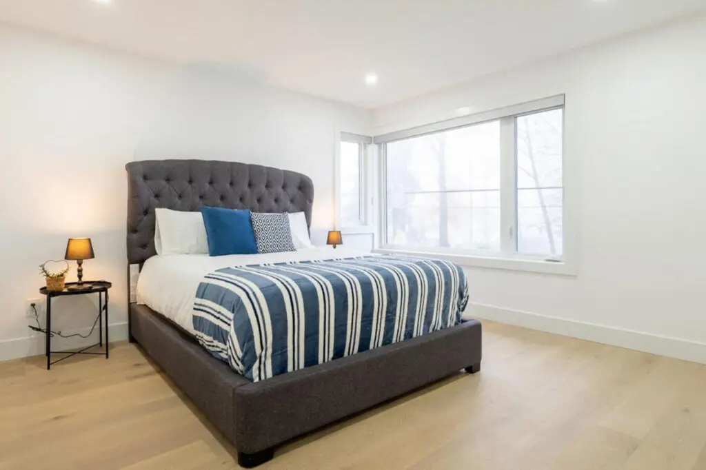 Bedroom 2: Relax in comfort in this stylish second bedroom featuring a plush queen bed and serene ambiance—perfect for restful nights and peaceful mornings during your stay.