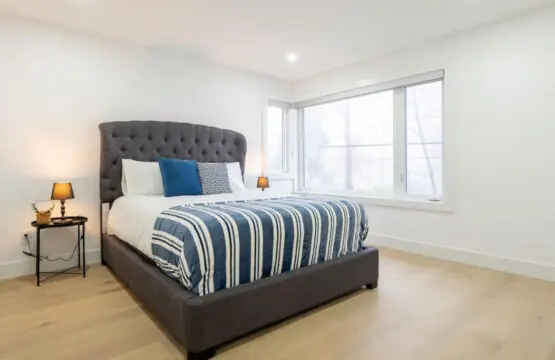 Bedroom 2: Relax in comfort in this stylish second bedroom featuring a plush queen bed and serene ambiance—perfect for restful nights and peaceful mornings during your stay.