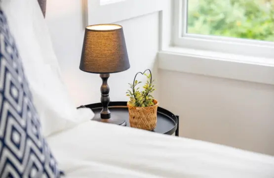 Bedroom 2: Thoughtful touches elevate this inviting queen bedroom, from warm lighting to cozy details that create a serene and restful atmosphere for your stay.