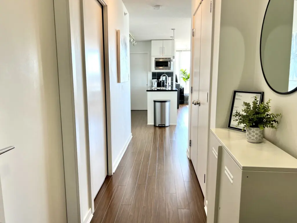 A bright, welcoming hallway connects the suite’s living spaces, blending modern design with a clean, open flow that enhances your Vancouver stay.