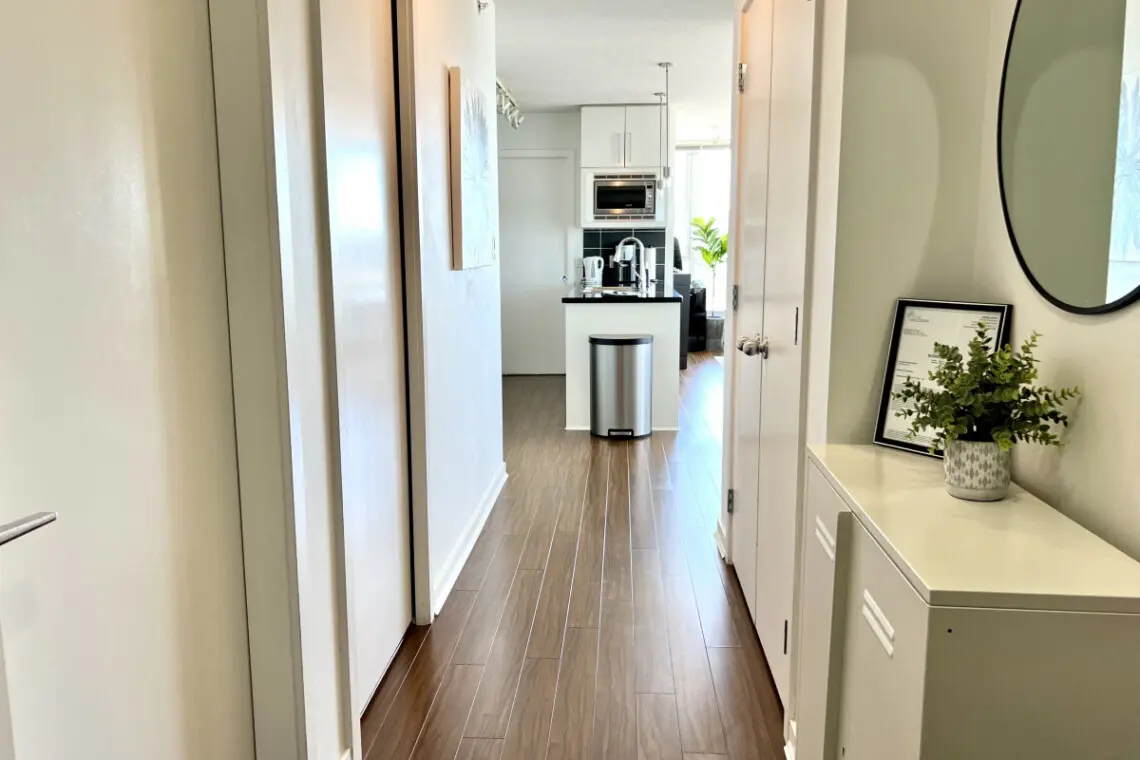 A bright, welcoming hallway connects the suite’s living spaces, blending modern design with a clean, open flow that enhances your Vancouver stay.