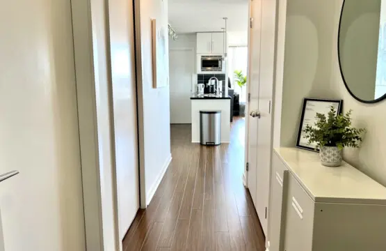 A bright, welcoming hallway connects the suite’s living spaces, blending modern design with a clean, open flow that enhances your Vancouver stay.