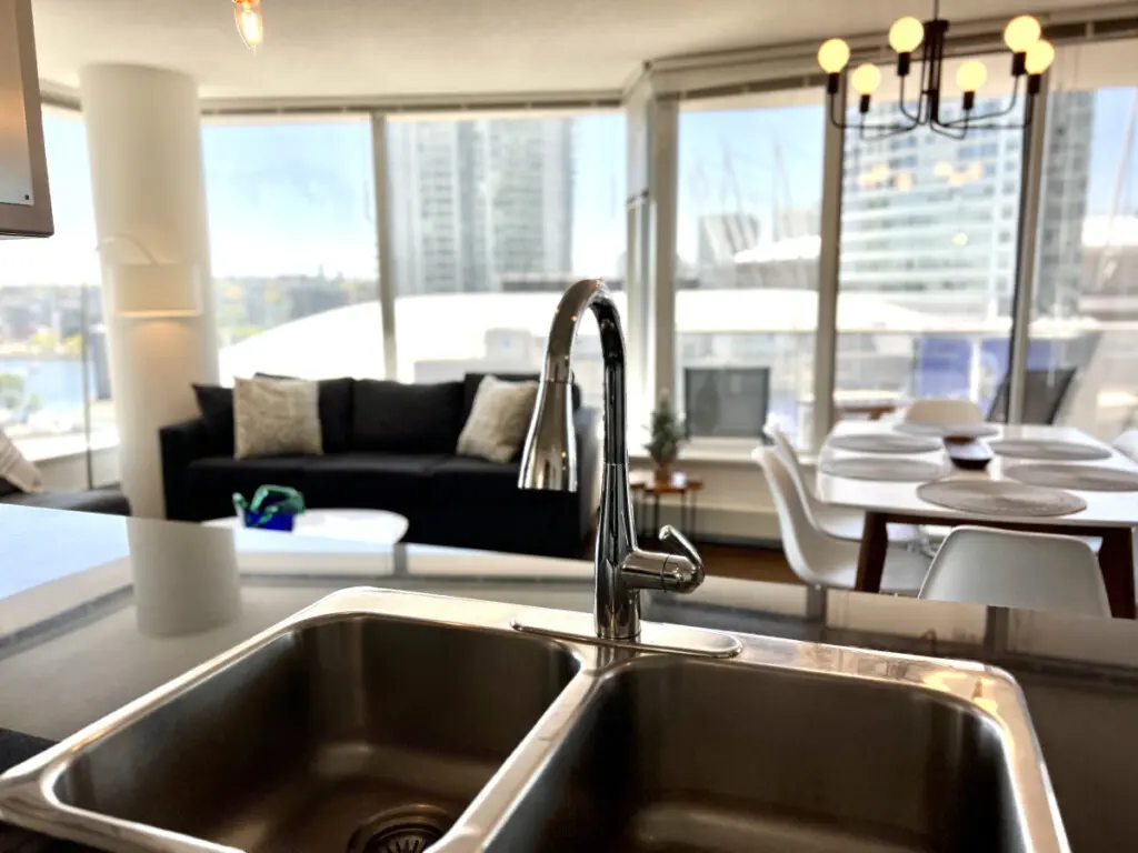 Enjoy modern simplicity in this thoughtfully designed kitchen space, where sleek finishes and open views create a perfect blend of style and function for your Vancouver stay.