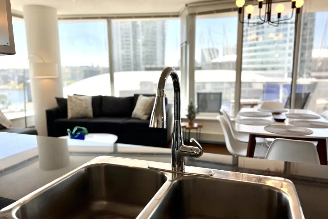 Enjoy modern simplicity in this thoughtfully designed kitchen space, where sleek finishes and open views create a perfect blend of style and function for your Vancouver stay.