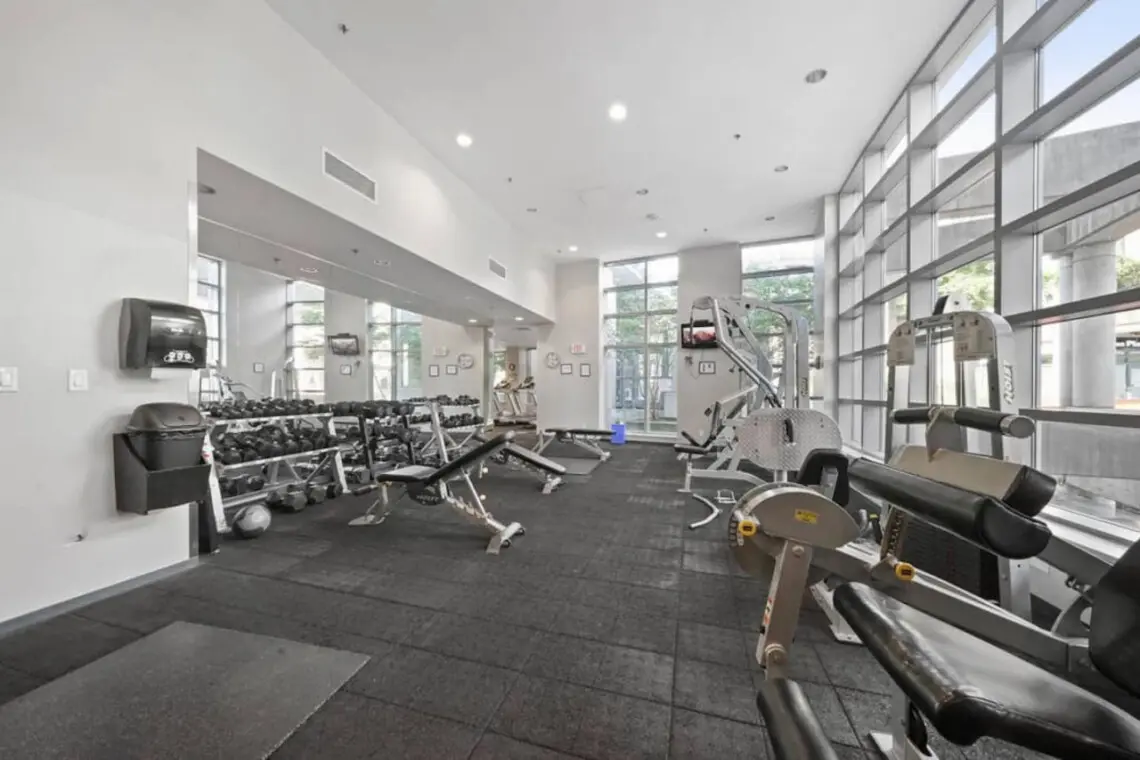 Maintain your fitness routine in the spacious, light-filled gym featuring free weights and strength-training equipment — designed for balance and wellness during your Vancouver stay.