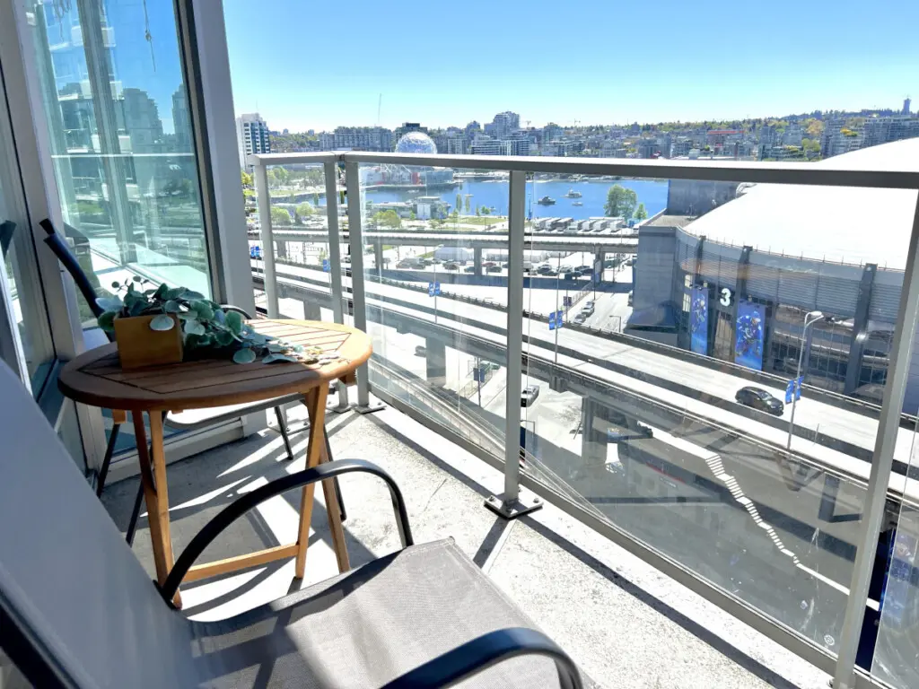 Take in the city and waterfront views from your private balcony retreat. Perfect for morning coffee or evening relaxation, this cozy outdoor nook offers a peaceful escape above the vibrant False Creek skyline.