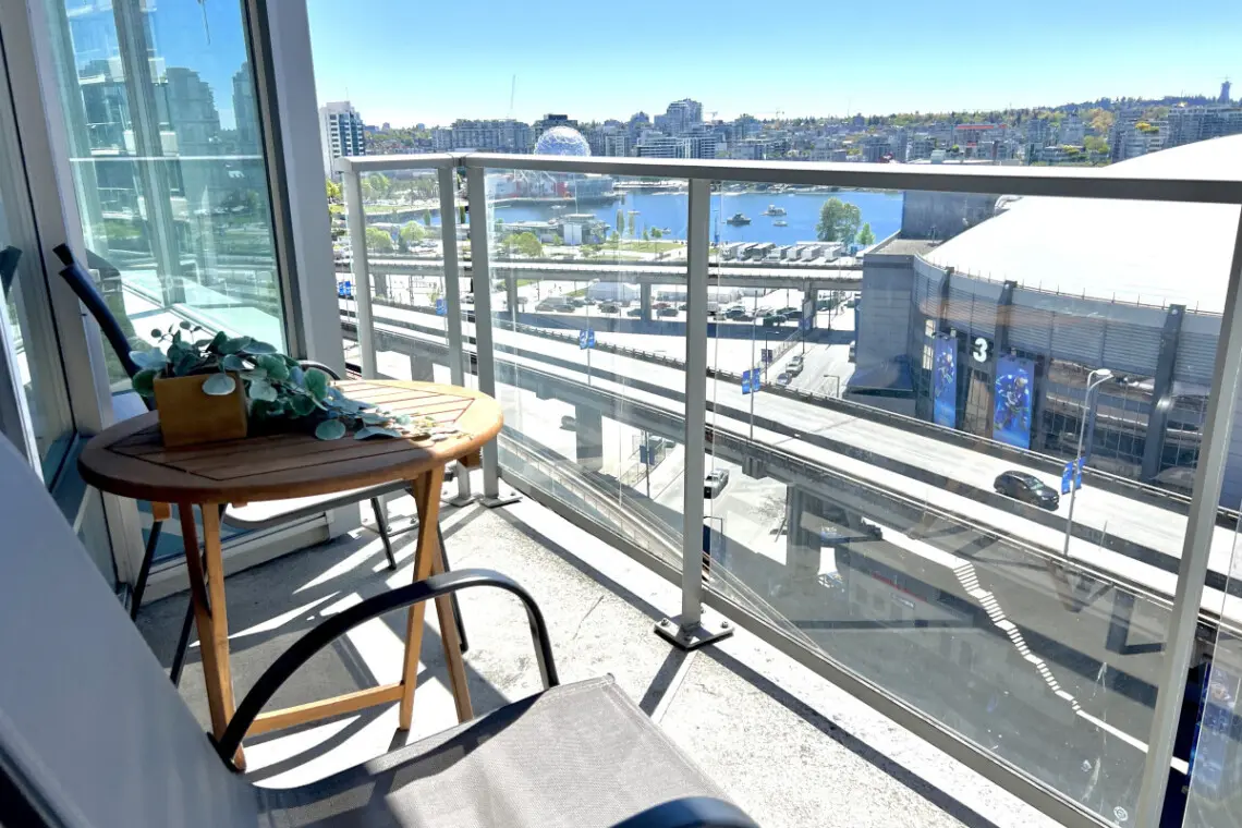 Take in the city and waterfront views from your private balcony retreat. Perfect for morning coffee or evening relaxation, this cozy outdoor nook offers a peaceful escape above the vibrant False Creek skyline.