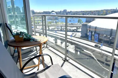 Take in the city and waterfront views from your private balcony retreat. Perfect for morning coffee or evening relaxation, this cozy outdoor nook offers a peaceful escape above the vibrant False Creek skyline.