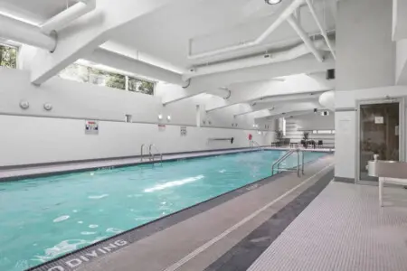 Take a refreshing dip in the indoor pool — a bright, inviting space perfect for relaxation or a few energizing laps during your Vancouver getaway.