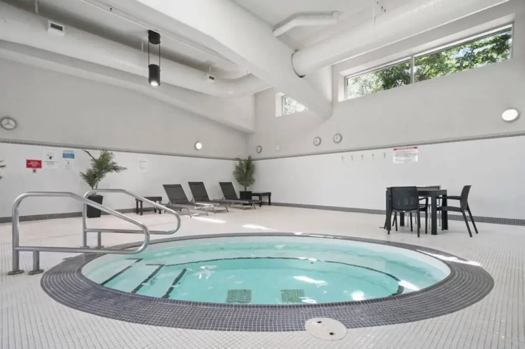 Relax and rejuvenate in the indoor hot tub, surrounded by natural light and calm ambiance — a soothing retreat after a day of exploring Vancouver.