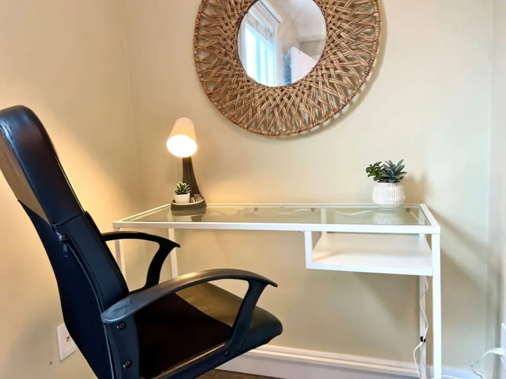 Stay productive in this cozy workspace, featuring a modern desk, comfortable chair, and calming accents — ideal for remote work or quiet focus time.