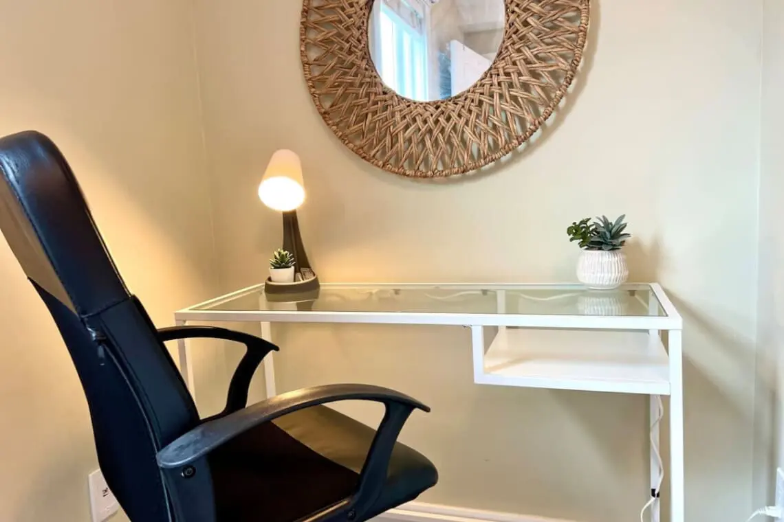 Stay productive in this cozy workspace, featuring a modern desk, comfortable chair, and calming accents — ideal for remote work or quiet focus time.