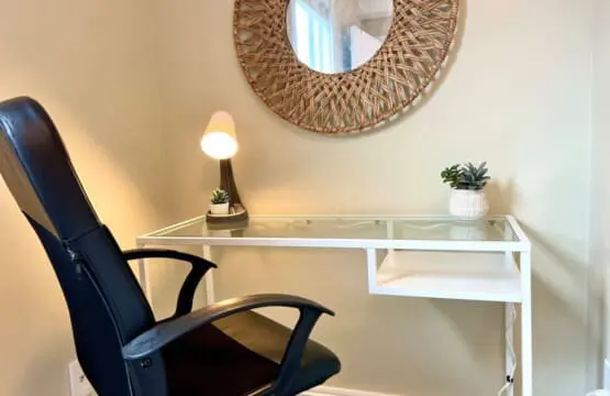 Stay productive in this cozy workspace, featuring a modern desk, comfortable chair, and calming accents — ideal for remote work or quiet focus time.