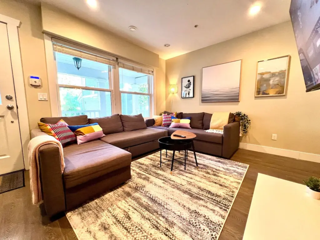 Stylish and inviting, this modern living room features chic décor, cozy seating, and a warm ambiance—perfect for relaxing or enjoying movie nights.