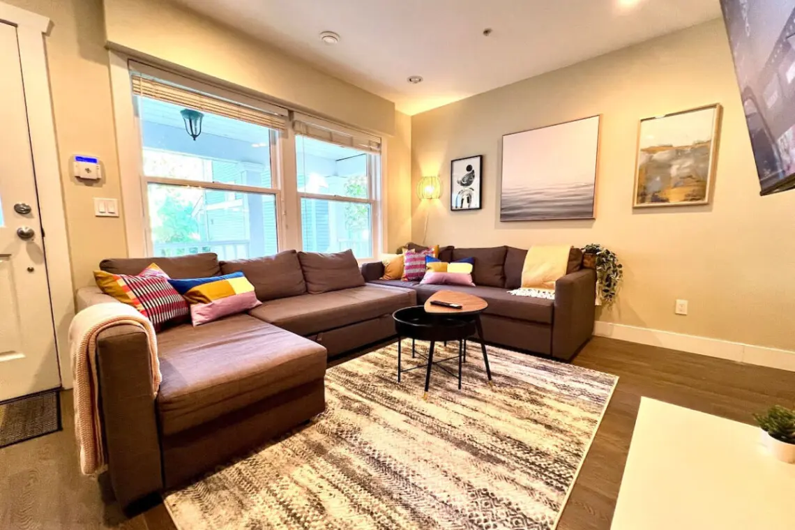 Stylish and inviting, this modern living room features chic décor, cozy seating, and a warm ambiance—perfect for relaxing or enjoying movie nights.