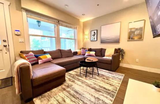 Stylish and inviting, this modern living room features chic décor, cozy seating, and a warm ambiance—perfect for relaxing or enjoying movie nights.